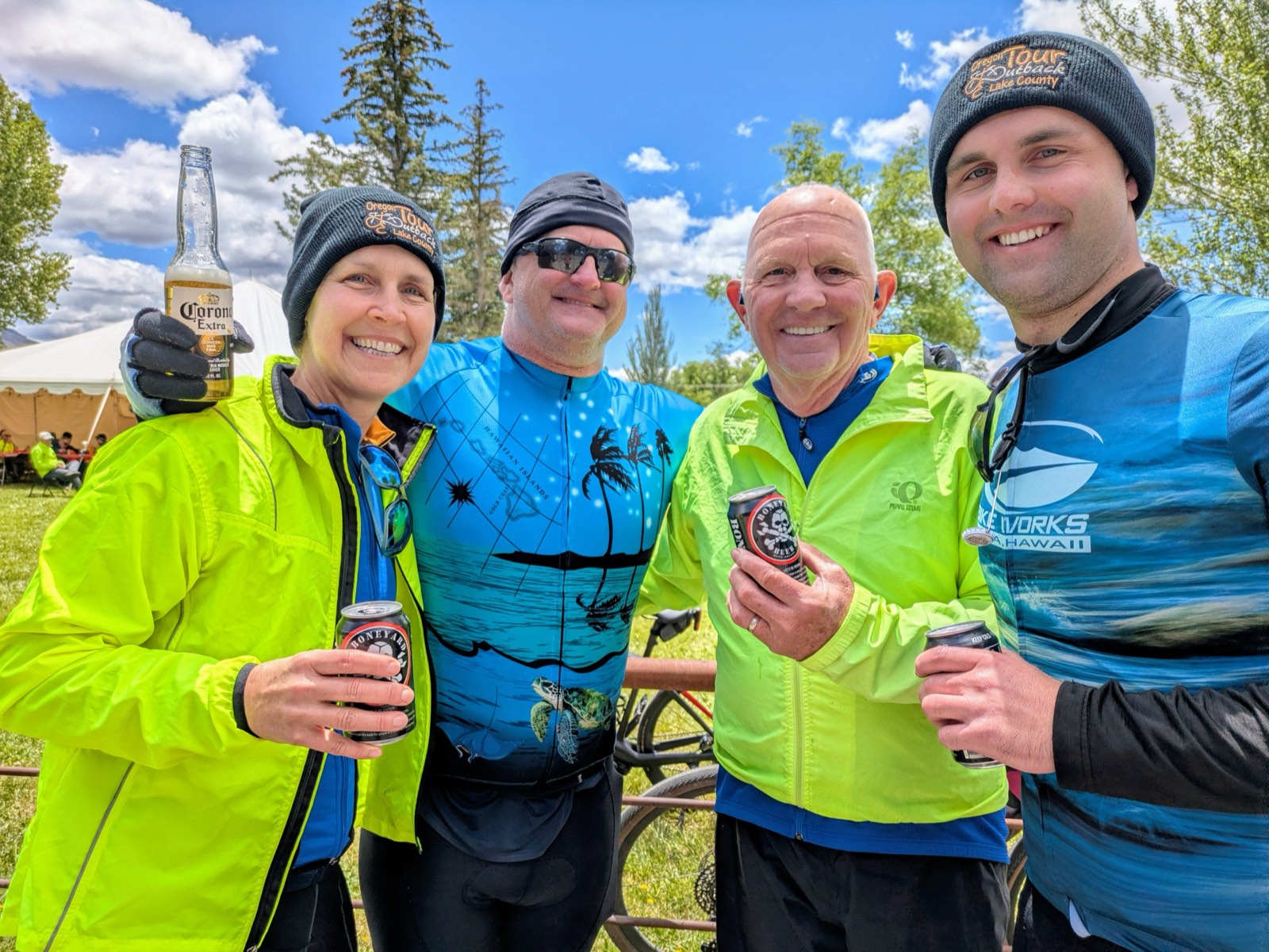 A group of riders toasting with local beer after finishing their ride
